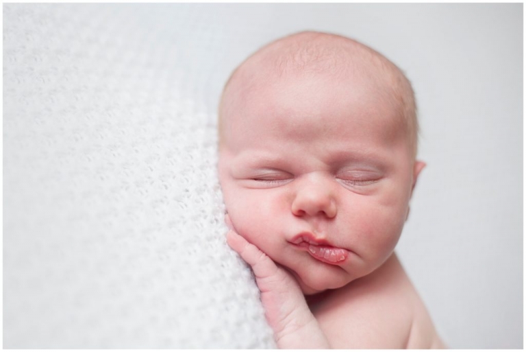 Pittsburgh posed newborn white backdrop pouty lips