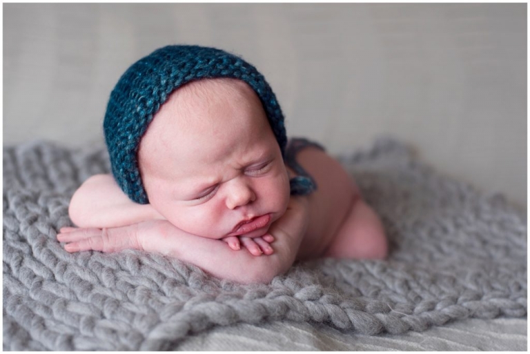 Pittsburgh posed newborn grey background wearing bonnet