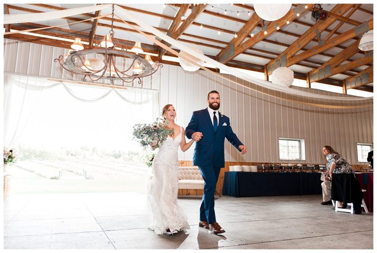 bride and groom enter reception at Destiny Hill Farm fall wedding