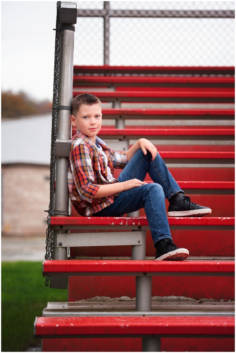 Pittsburgh boy child portrait session on bleachers at baseball field