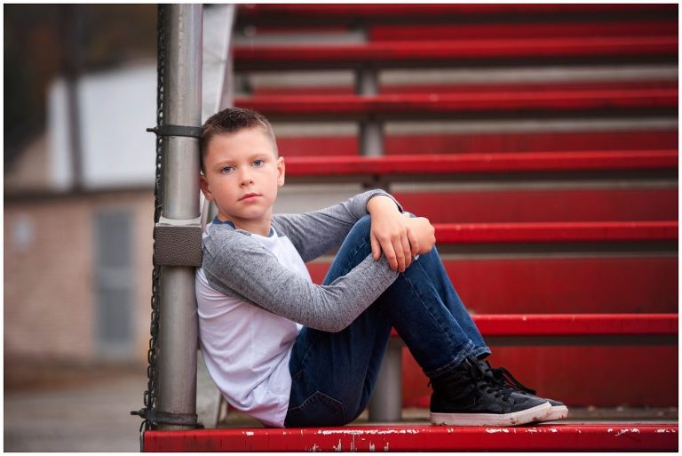 Pittsburgh boy child portrait session on bleachers at baseball field