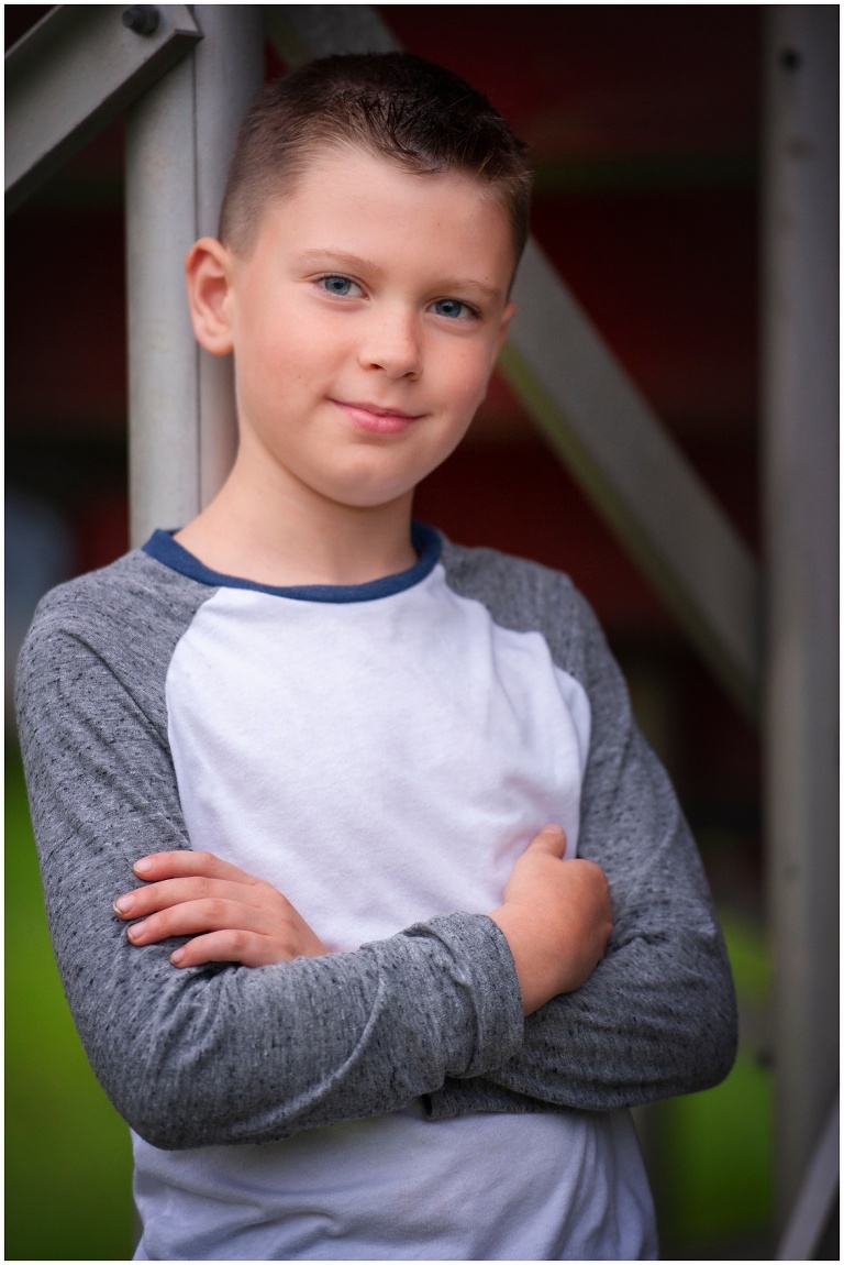 Pittsburgh boy child portrait session under bleachers at baseball field