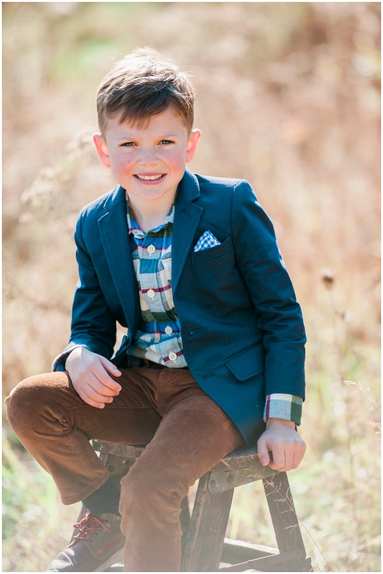 fall family session on farm in tall grass